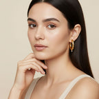 Seraphina Treasures Corvella gold hoop earrings with silver bead accent. Elegant, modern design.