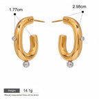 Seraphina Treasures Corvella gold hoop earrings with silver bead accents. Waterproof and hypoallergenic.