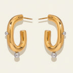 Seraphina Treasures Corvella gold hoop earrings with silver bead accents. Unique, elegant design.
