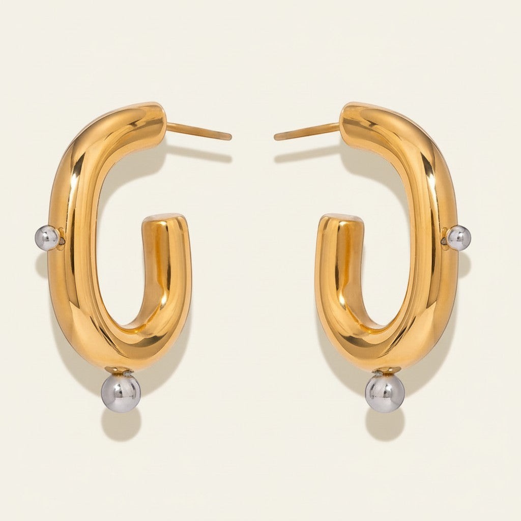 Seraphina Treasures Corvella gold hoop earrings with silver bead accents. Unique, elegant design.