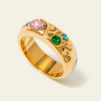 Seraphina Treasures Corvian ring with pink, green, and blue gemstones set in gold.