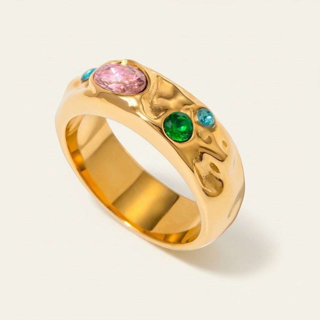 Seraphina Treasures Corvian ring with pink, green, and blue gemstones set in gold.