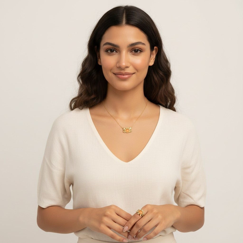 Seraphina Treasures gold crab necklace and ring with red opal accents. Nature-inspired jewelry.