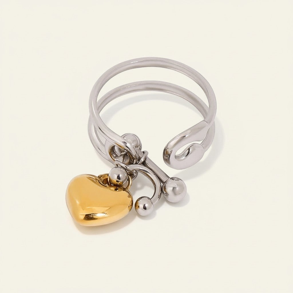 Seraphina Treasures Cressida ring with double layer silver band and gold heart charm. Open adjustable style.