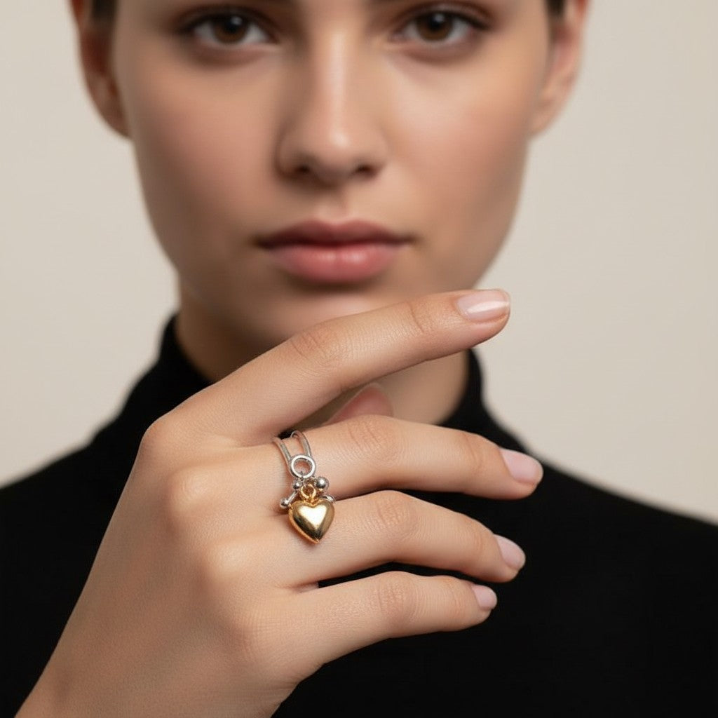 Seraphina Treasures Cressida ring with a gold heart pendant and double-layer silver band.
