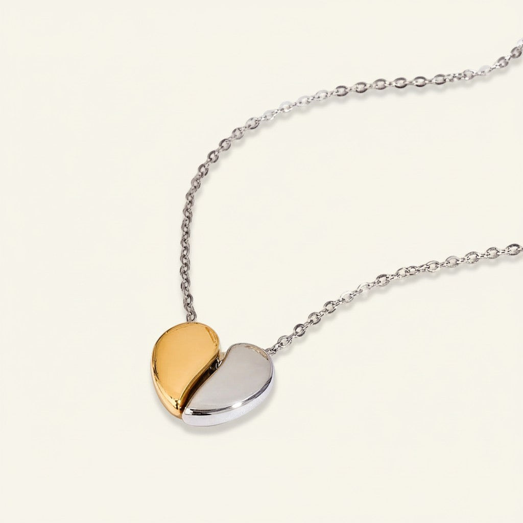 Seraphina Treasures Cupris necklace with a gold and silver heart pendant, symbolizing connection and unity.
