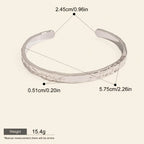Seraphina Treasures Cyrine silver-tone metal open bangle with hammered texture. Waterproof and hypoallergenic.