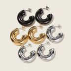 Seraphina Treasures Cyrisa chunky hoop earrings in black, gold, and silver finishes. Vintage-inspired design.