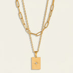 Seraphina Treasures Daphne layered gold necklace with rectangular pendant featuring a starburst cubic zirconia.