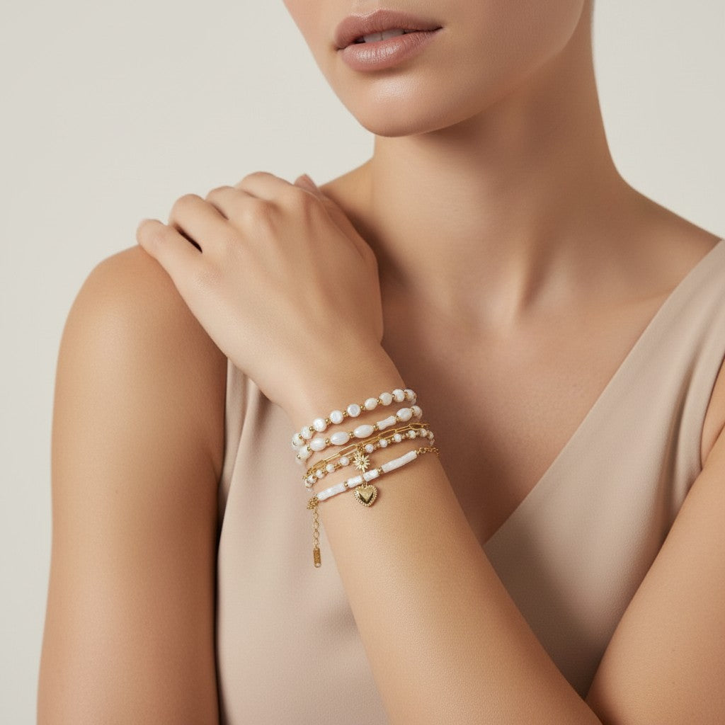 Seraphina Treasures Delia bracelet set with white shells and gold accents, featuring a heart charm.