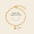 Seraphina Treasures Delia bracelet with gold chain, white shell beads, and a sun charm.