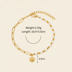 Seraphina Treasures Delia bracelet with gold chain, white shell beads, and a sun charm.