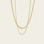 Seraphina Treasures Dina layered gold snake and rope chain necklaces.