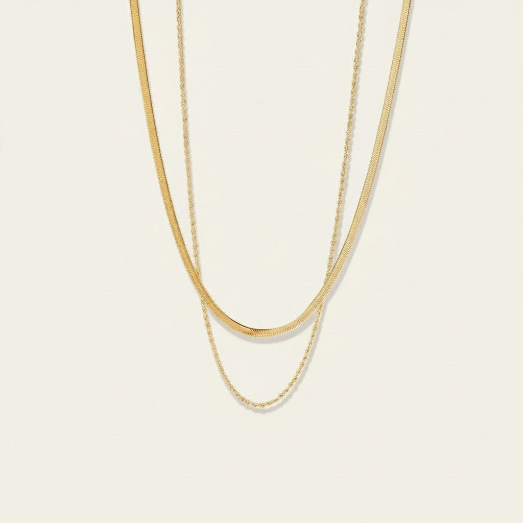 Seraphina Treasures Dina layered gold snake and rope chain necklaces.