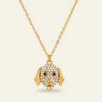 Seraphina Treasures gold-tone necklace with a crystal-encrusted dog face pendant and black eyes.