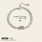 Seraphina Treasures Domitilla bracelet with clear and pink square zirconia stones, silver-tone metal, and adjustable clasp.