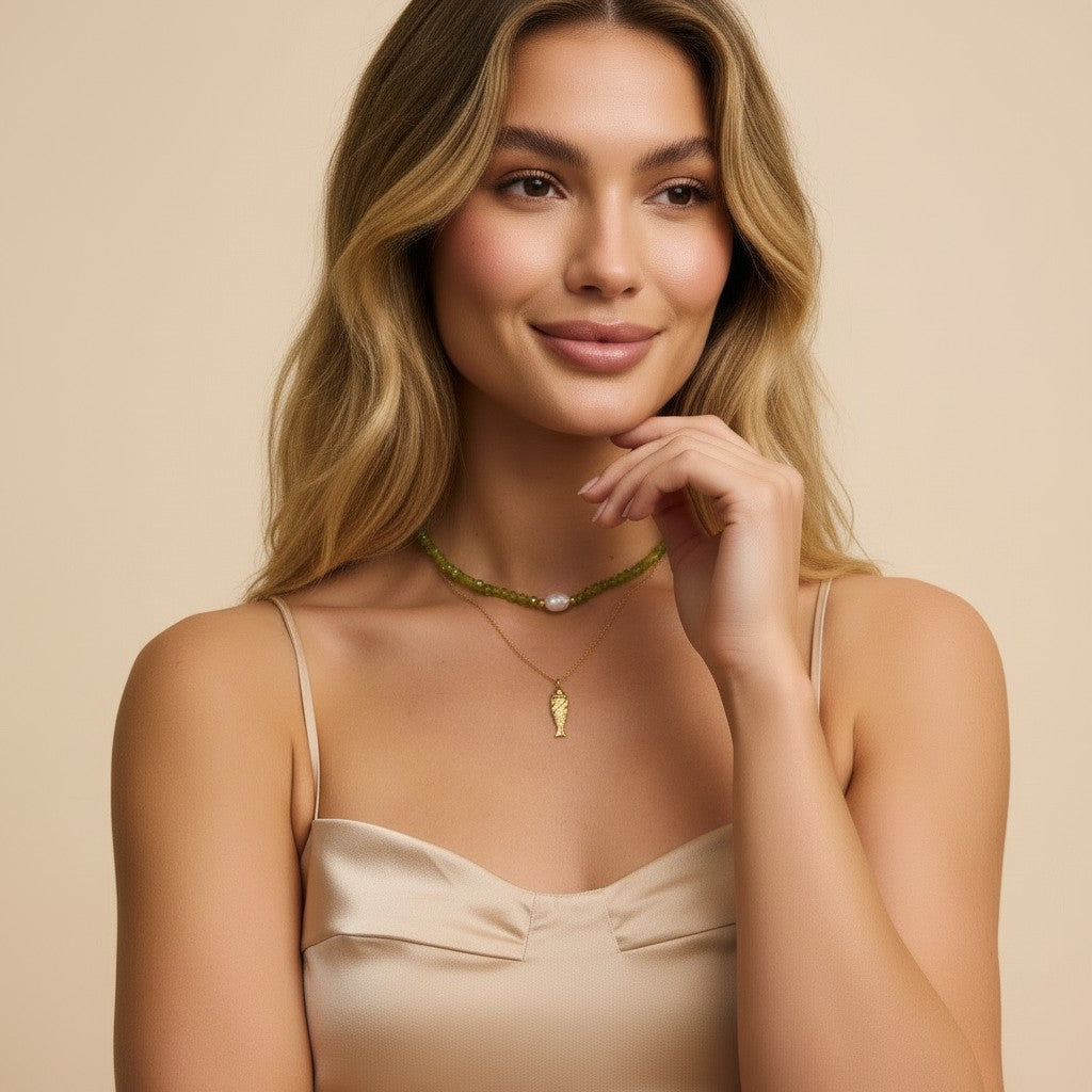Seraphina Treasures Eira necklace with gold carp pendant and green beaded chain with pearl accent.