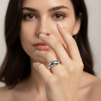 Seraphina Treasures Electra gold ring with a flowing, irregular wave design on a woman's finger.