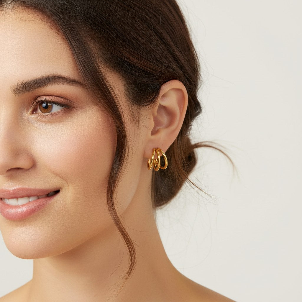 Seraphina Treasures Elidyr gold triple hoop earrings with a shiny finish.