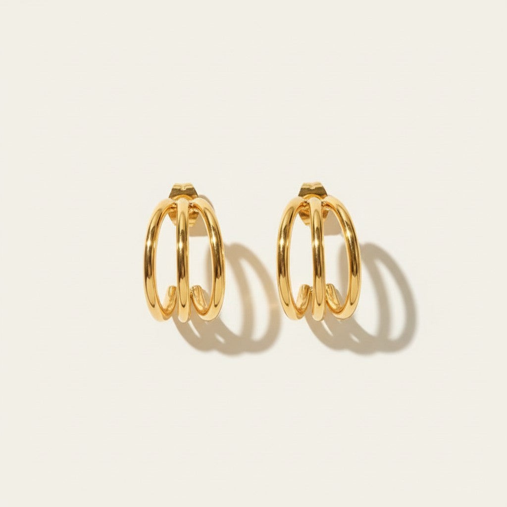 Seraphina Treasures Elidyr gold triple hoop earrings with a shiny finish.