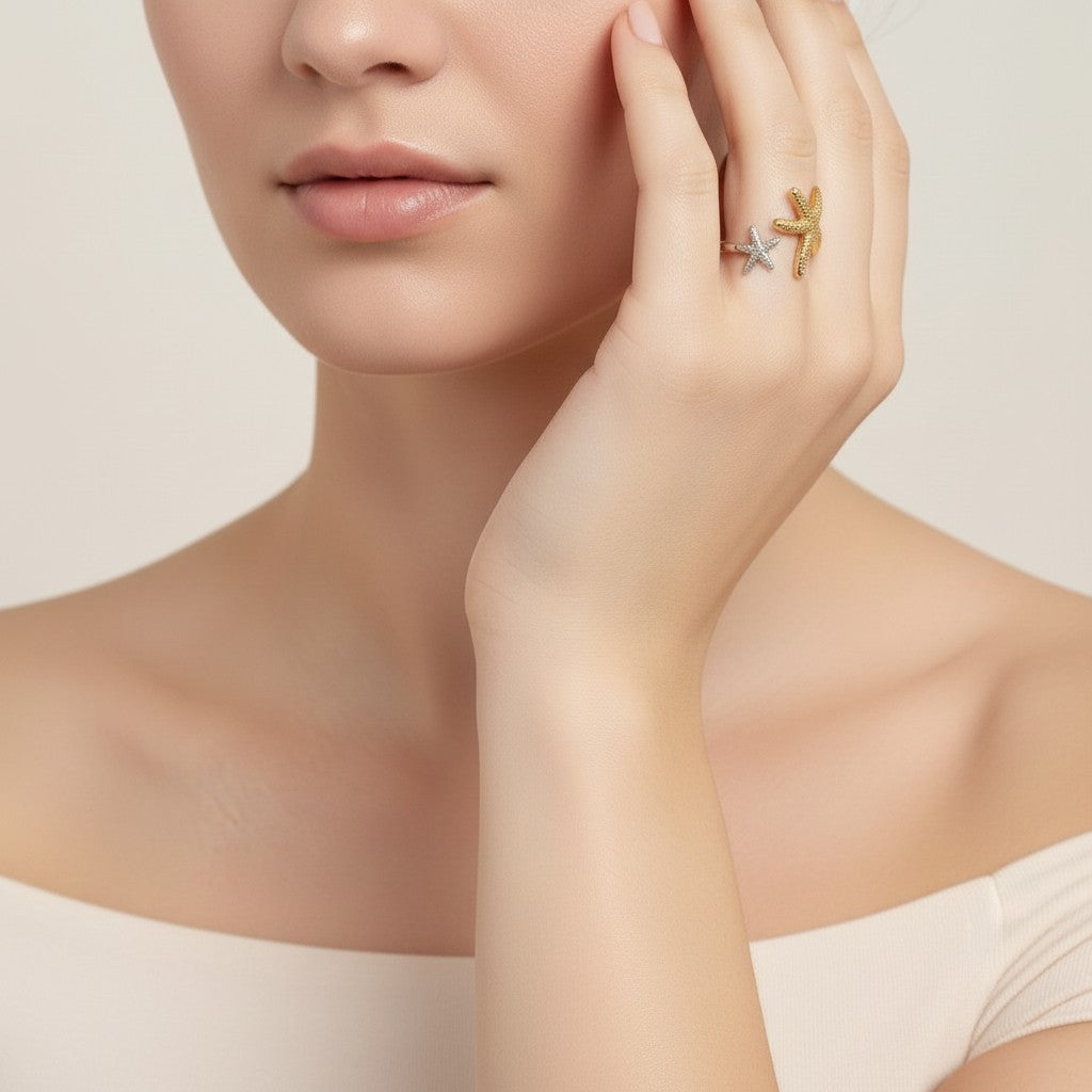 Seraphina Treasures Elysia open ring with two starfish designs, one gold-tone and one silver-tone with clear stones.