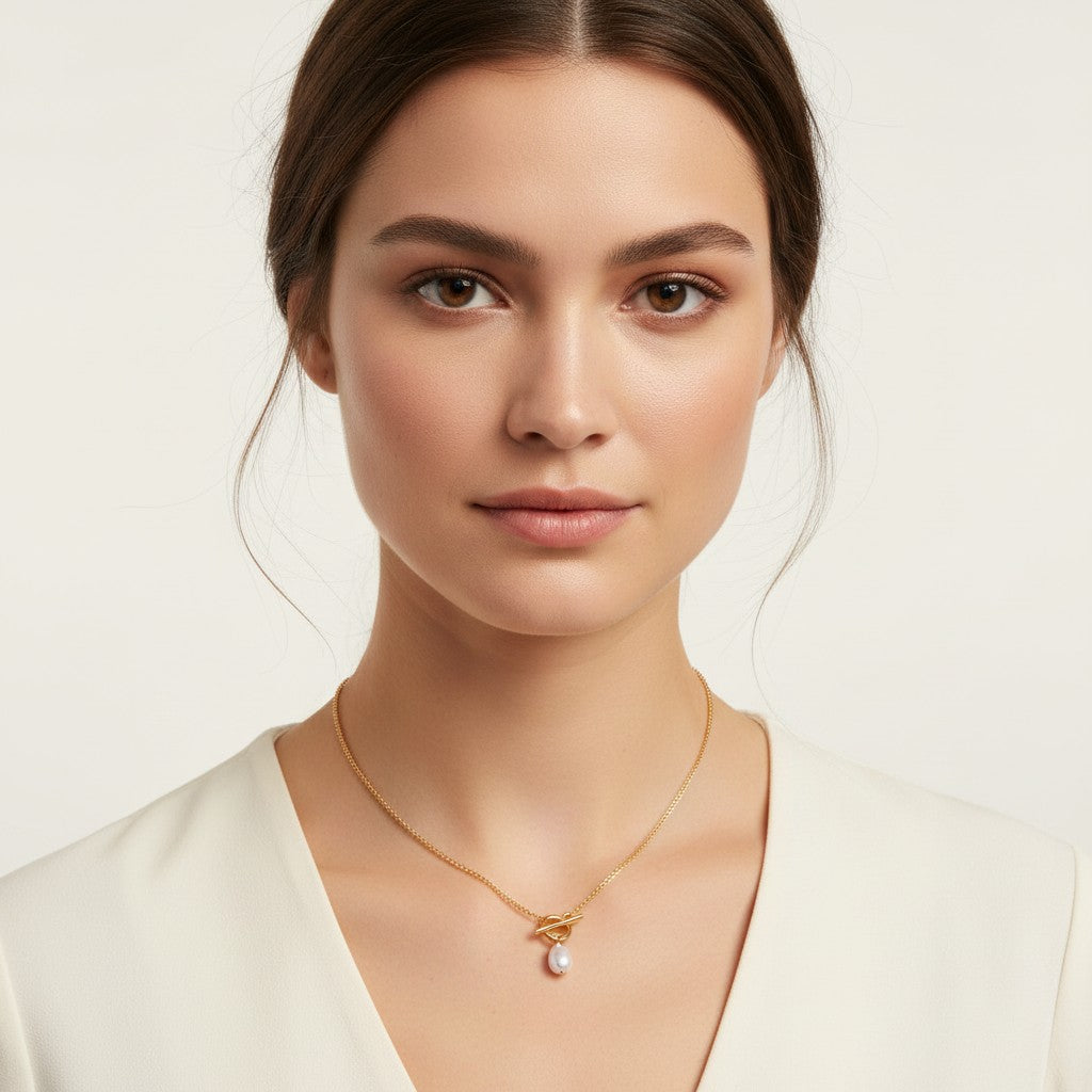 Seraphina Treasures Emberlyn necklace with a gold chain and a single pearl pendant.