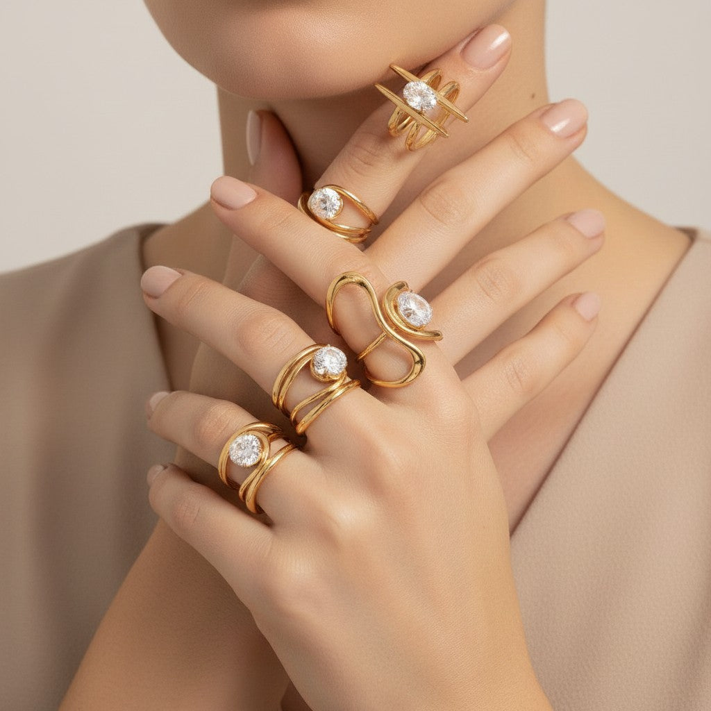Seraphina Treasures Emerya Rings, set of 4 gold-tone rings with clear cubic zirconia stones, delicate and modern designs.