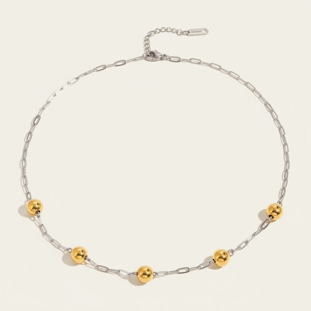 Seraphina Treasures Eosphor mixed metal necklace with gold beads on a silver chain. Adjustable clasp.