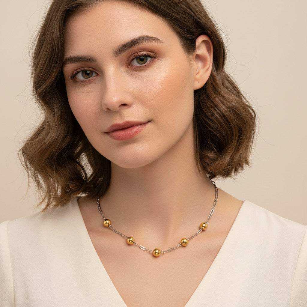 Seraphina Treasures Eosphor mixed metal necklace with gold beads and silver chain, perfect for layering.
