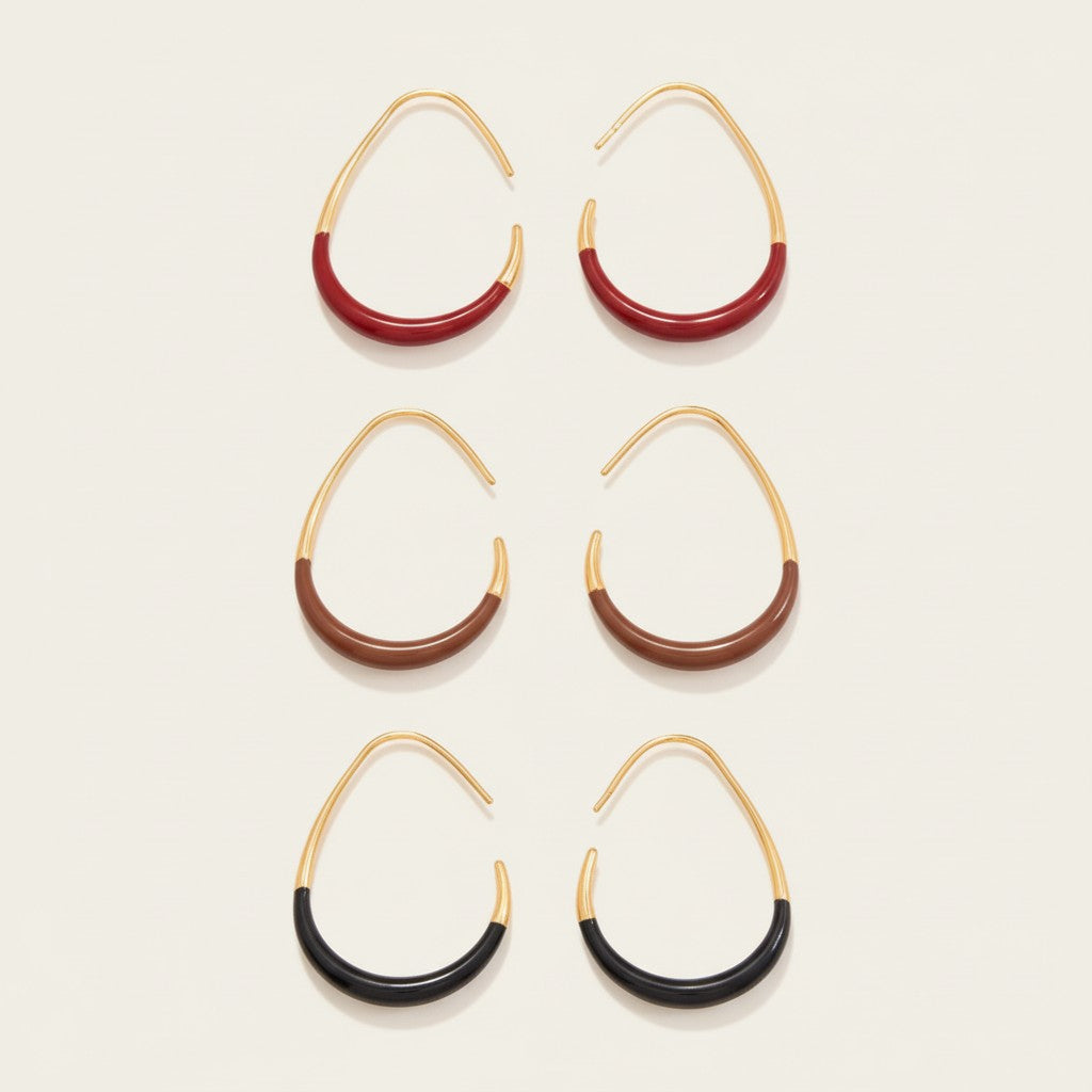Seraphina Treasures Eudynelle gold hoop earrings with red, brown, and black enamel drip detail.