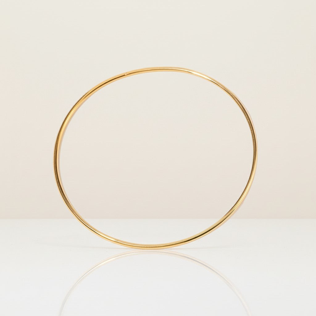 Seraphina Treasures Eulalia thin gold bangle bracelet, minimalist design.
