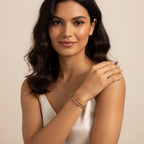 Seraphina Treasures Evadne bracelet with gold and silver tones, featuring a slim, open design with small decorative beads.
