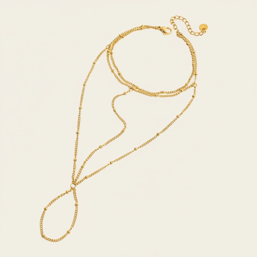 Seraphina Treasures Faustina gold-tone layered body chain bracelet with delicate bead accents.