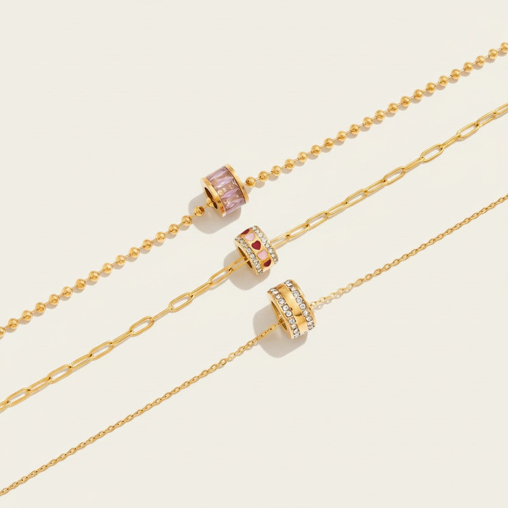 Seraphina Treasures Florentia necklace with gold chains and crystal bead pendants in pink, red hearts, and clear.