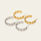 Seraphina Treasures Floriva gold and silver hoop earrings with small flower designs.