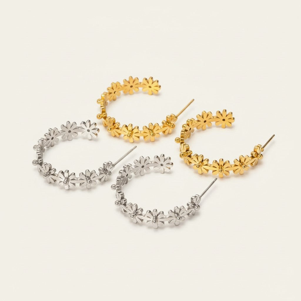 Seraphina Treasures Floriva gold and silver hoop earrings with small flower designs.