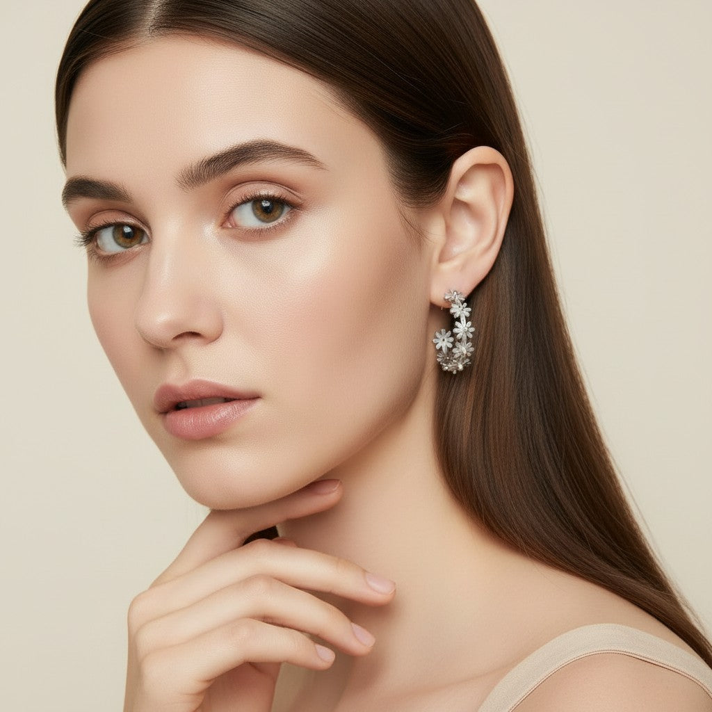 Seraphina Treasures Floriva gold hoop earrings with small flower designs.