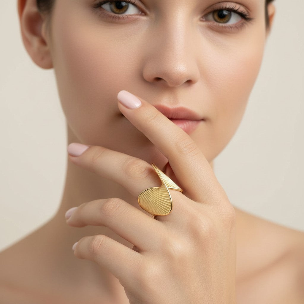 Seraphina Treasures Galatea gold ring with geometric, textured design on a finger.