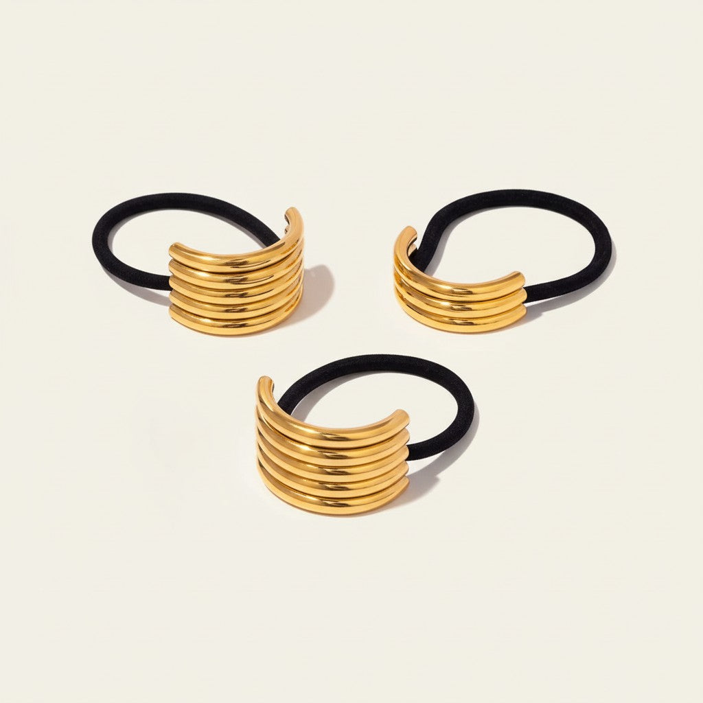 Seraphina Treasures Glintara gold multi-layer hollow hair accessories with black elastic bands.
