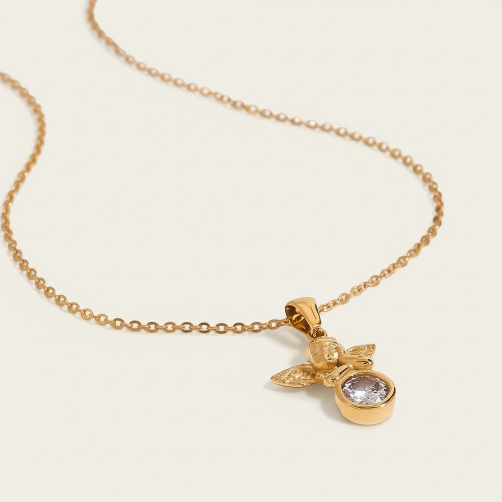 Seraphina Treasures gold angel necklace with clear rhinestone pendant. Delicate chain, elegant sparkle, symbolic protection and hope.