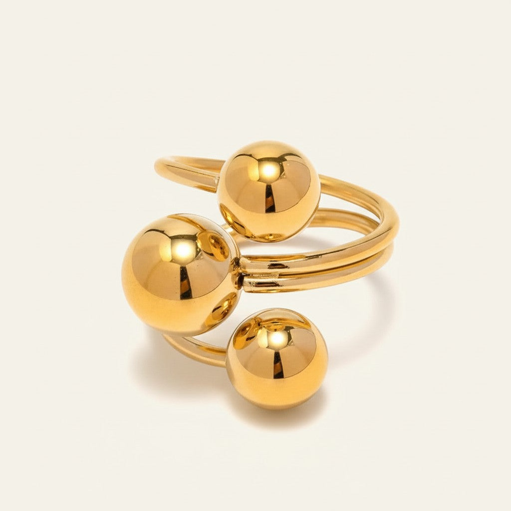 Seraphina Treasures gold-tone open ring with three polished ball accents, modern design.