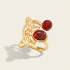 Seraphina Treasures gold bee ring with red agate gemstones. Open design, adjustable fit.