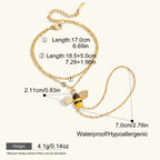 Seraphina Treasures gold-tone bracelet with a bee charm, featuring zircon accents and yellow and black enamel.