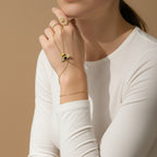 Seraphina Treasures gold bracelet connected to a ring, featuring a bee motif with zircon accents and yellow enamel.