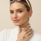 Seraphina Treasures gold bracelet connected to a ring, featuring a bee motif with zircon accents and a small heart charm.