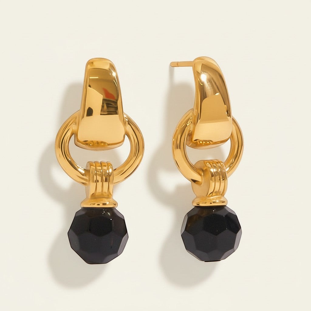Seraphina Treasures Aurethia gold earrings with faceted black crystal drops. Elegant dangle design.