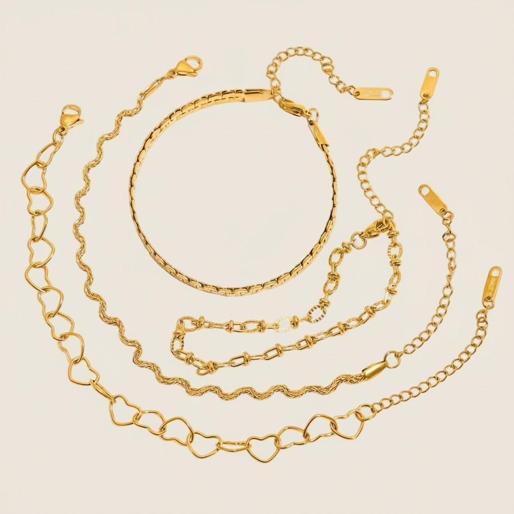 Seraphina Treasures Chrysara gold-tone bracelet set with heart, chain, and snake designs. Adjustable.