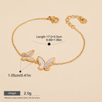 Seraphina Treasures gold-tone bracelet with white shell butterfly charms. Adjustable chain.