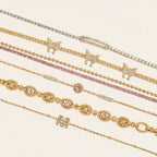 Seraphina Treasures gold-tone bracelets with cubic zirconia, pink stones, and butterfly charms.