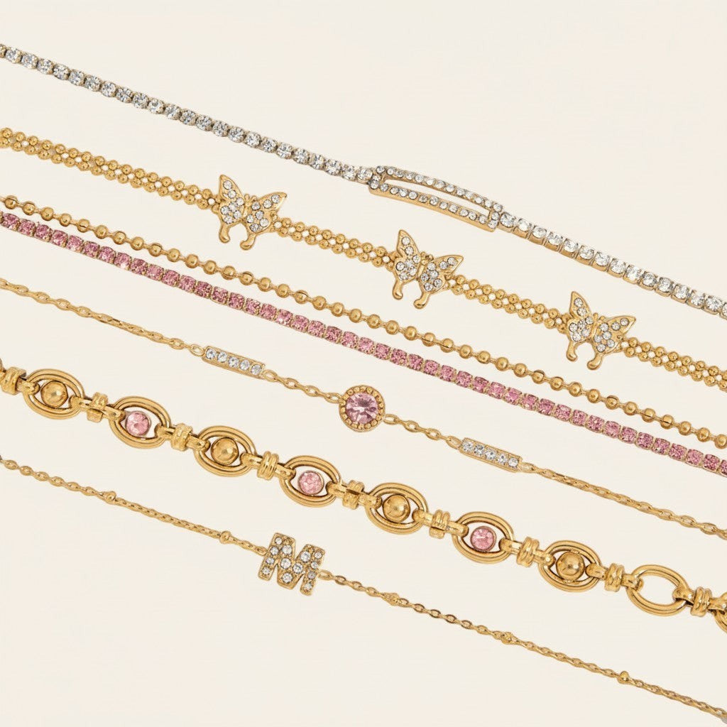 Seraphina Treasures gold-tone bracelets with cubic zirconia, pink stones, and butterfly charms.